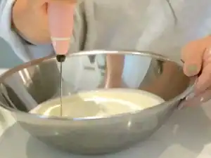 Making fresh whipped cream with electric hand whisk for Japanese Fruit Sando