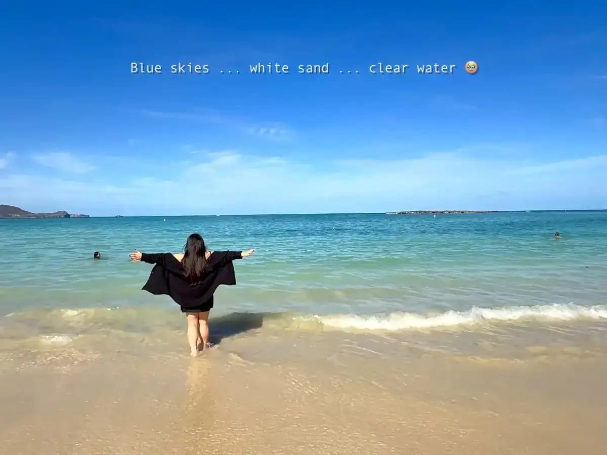 Tiffy Visiting Lanikai Beach in Honolulu, Oahu, which has white sands, blue skys, and super clear water in Hawaii