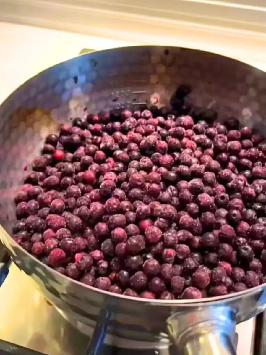 Cooking frozen blueberry for jam for healthy fizzy Blueberry Chia Drink
