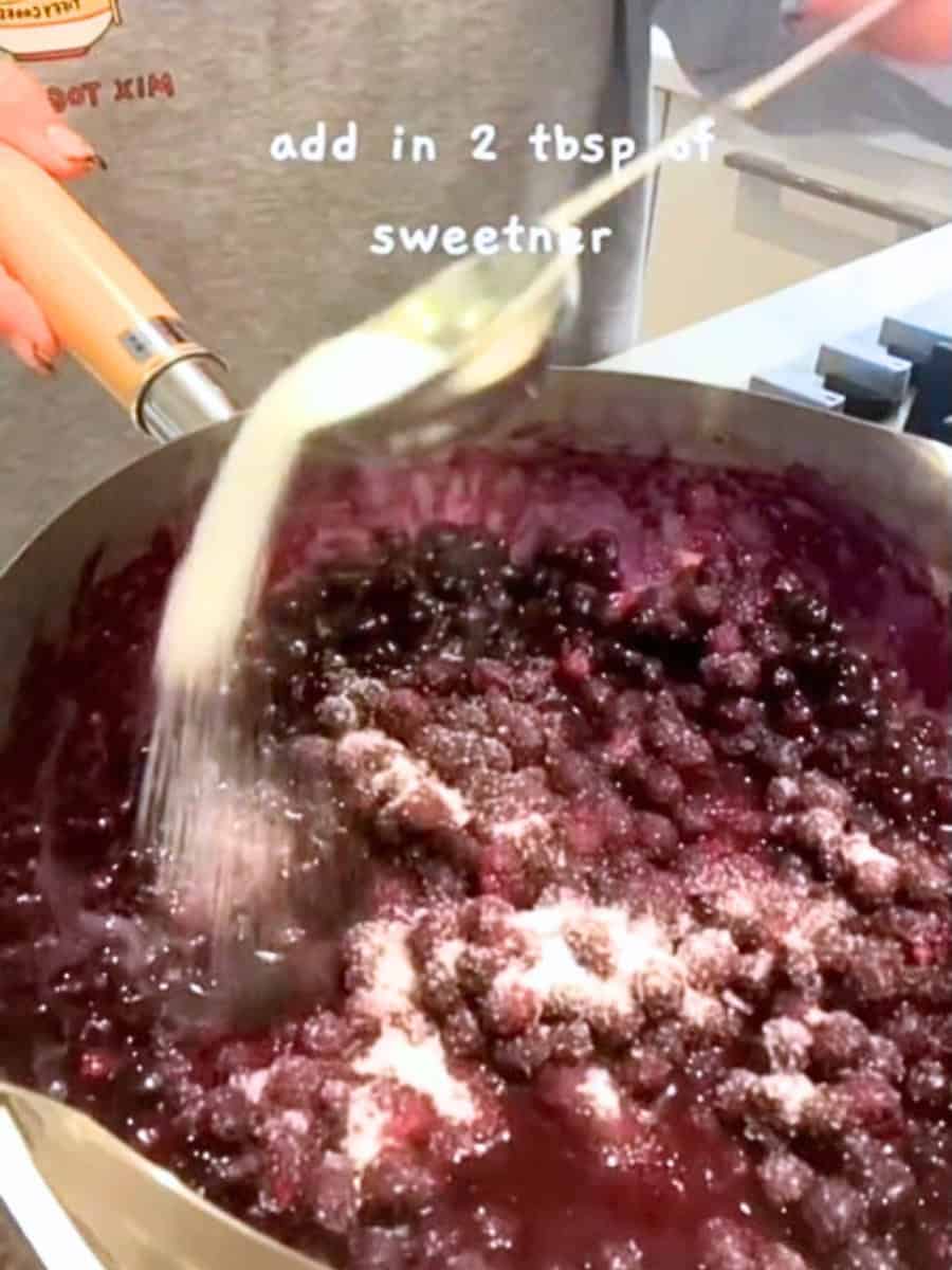 Adding Sugar to make blueberry jam for healthy fizzy Blueberry Chia Drink