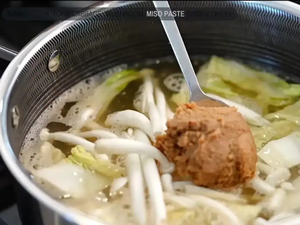Cooking miso soup with napa cabbage and tofu for birthday brunch 