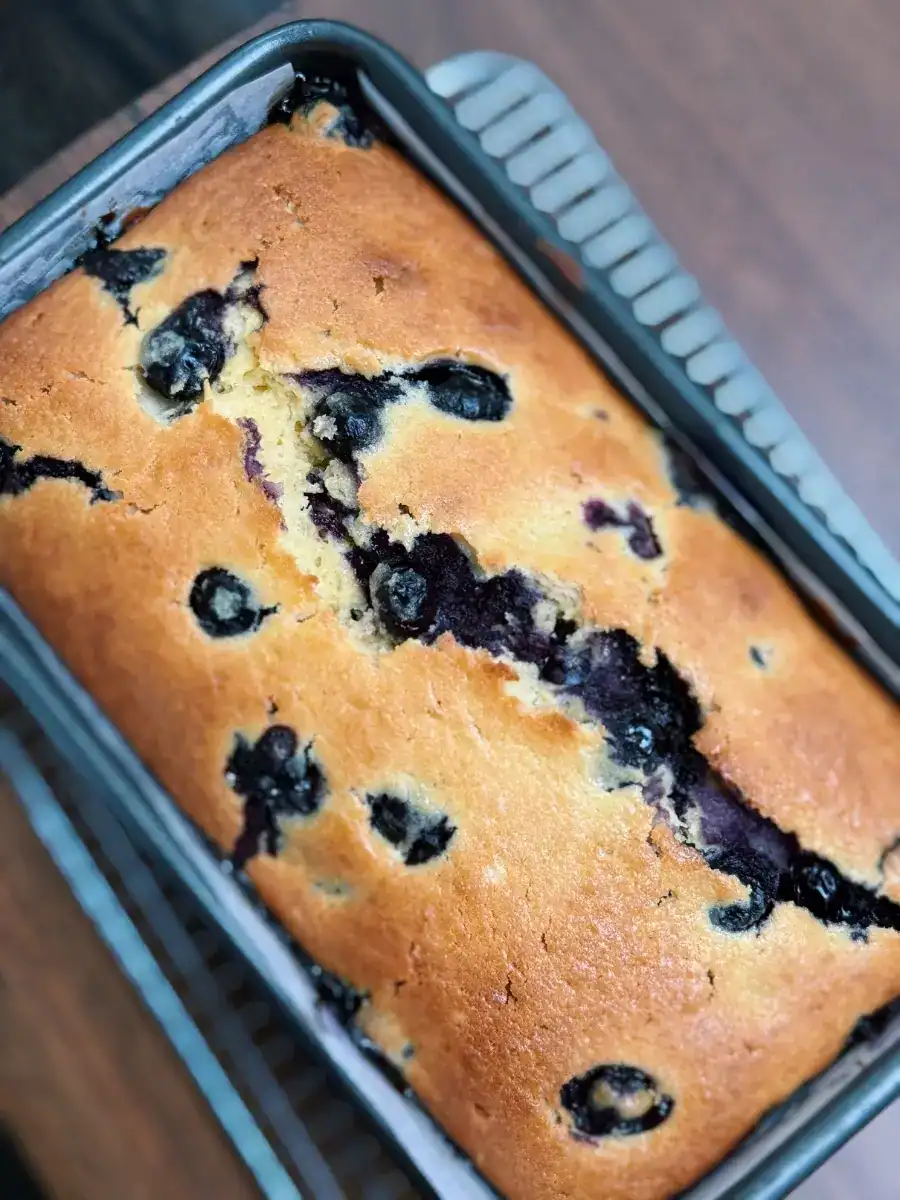 Freshly baked blueberry lemon loaf, showing the perfect golden color for the loaf