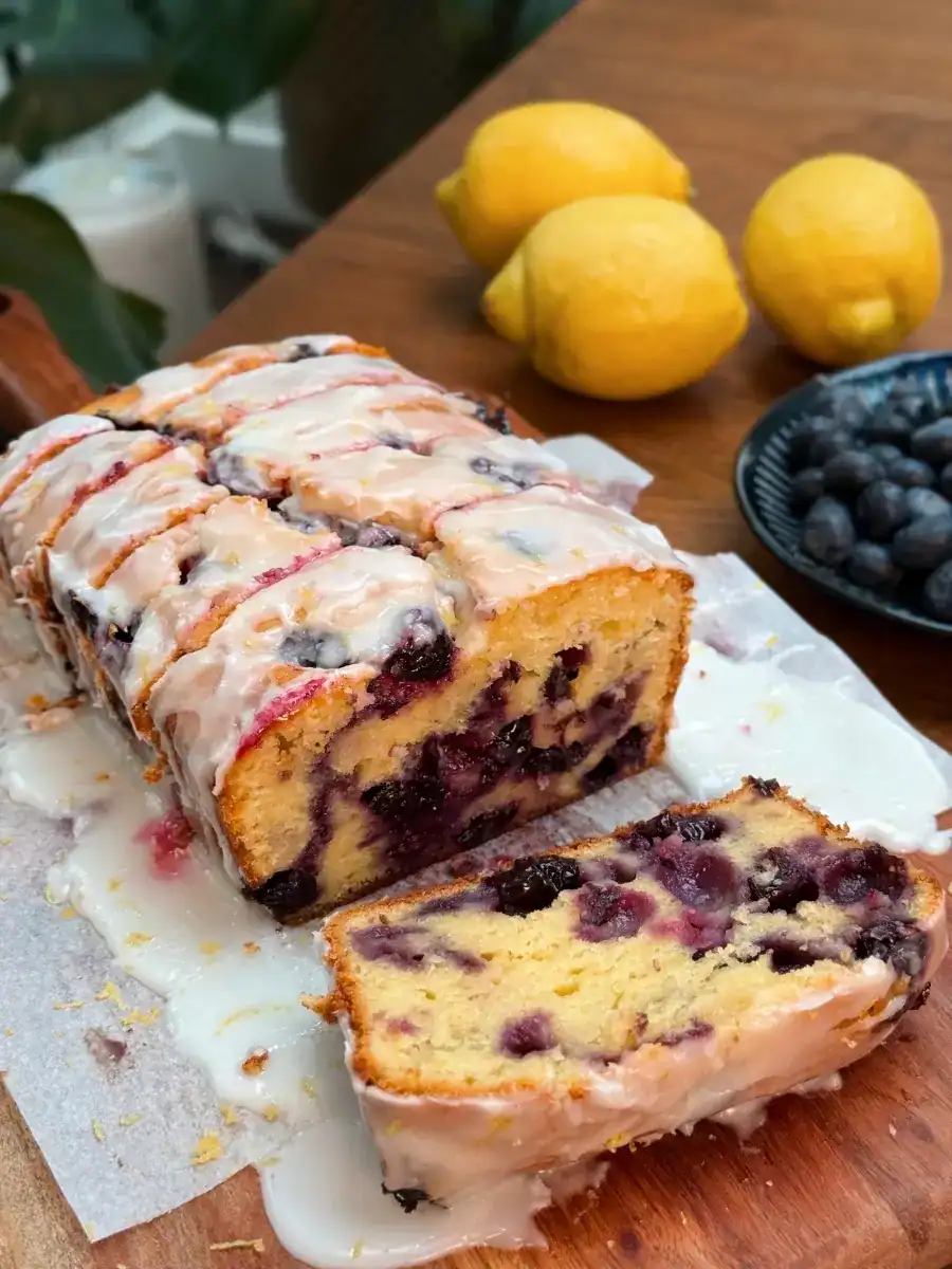 Glazed Lemon Blueberry Loaf sliced to show the