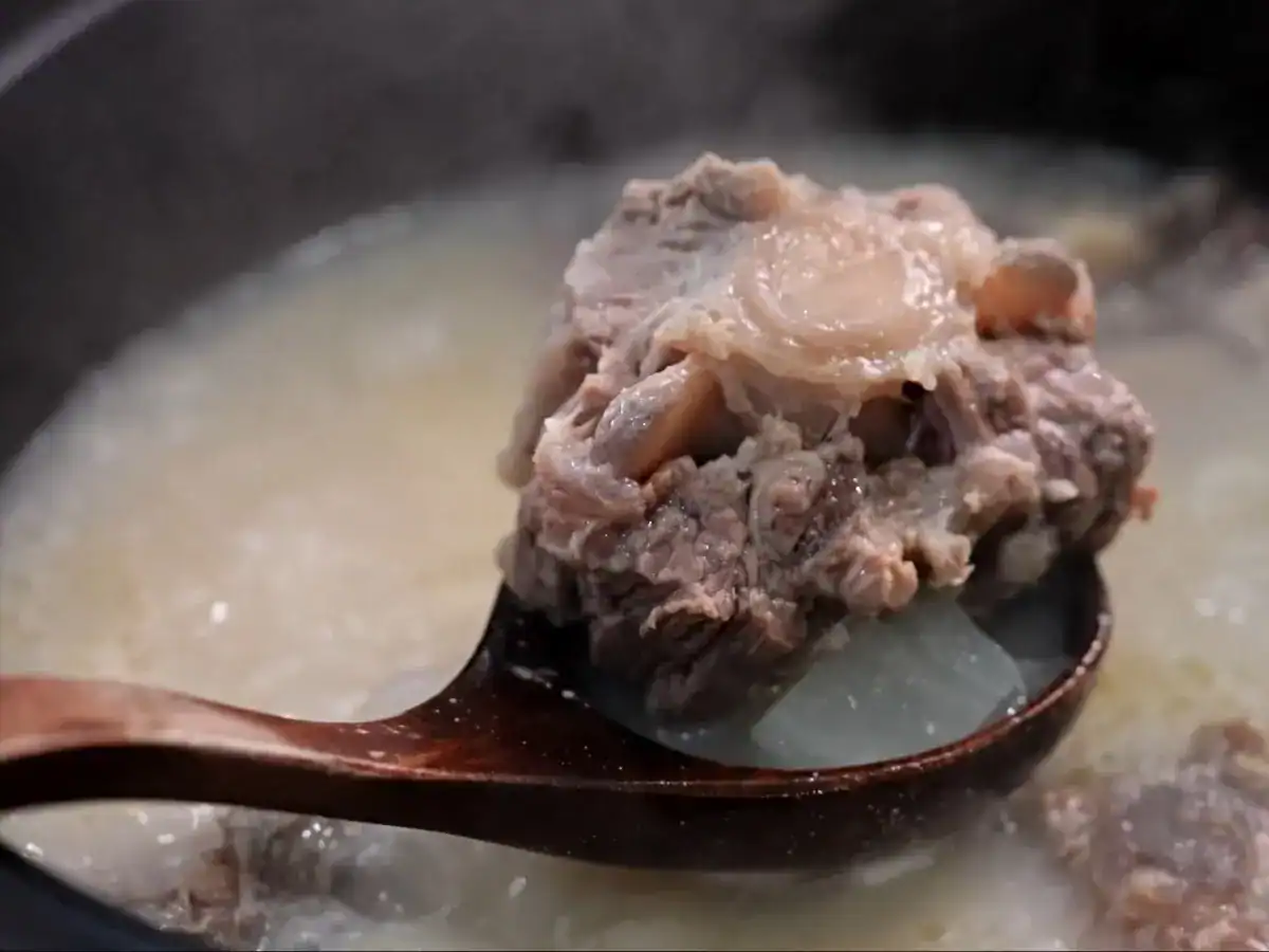 A closeup view of cooked oxtail after simmering in oxtail soup