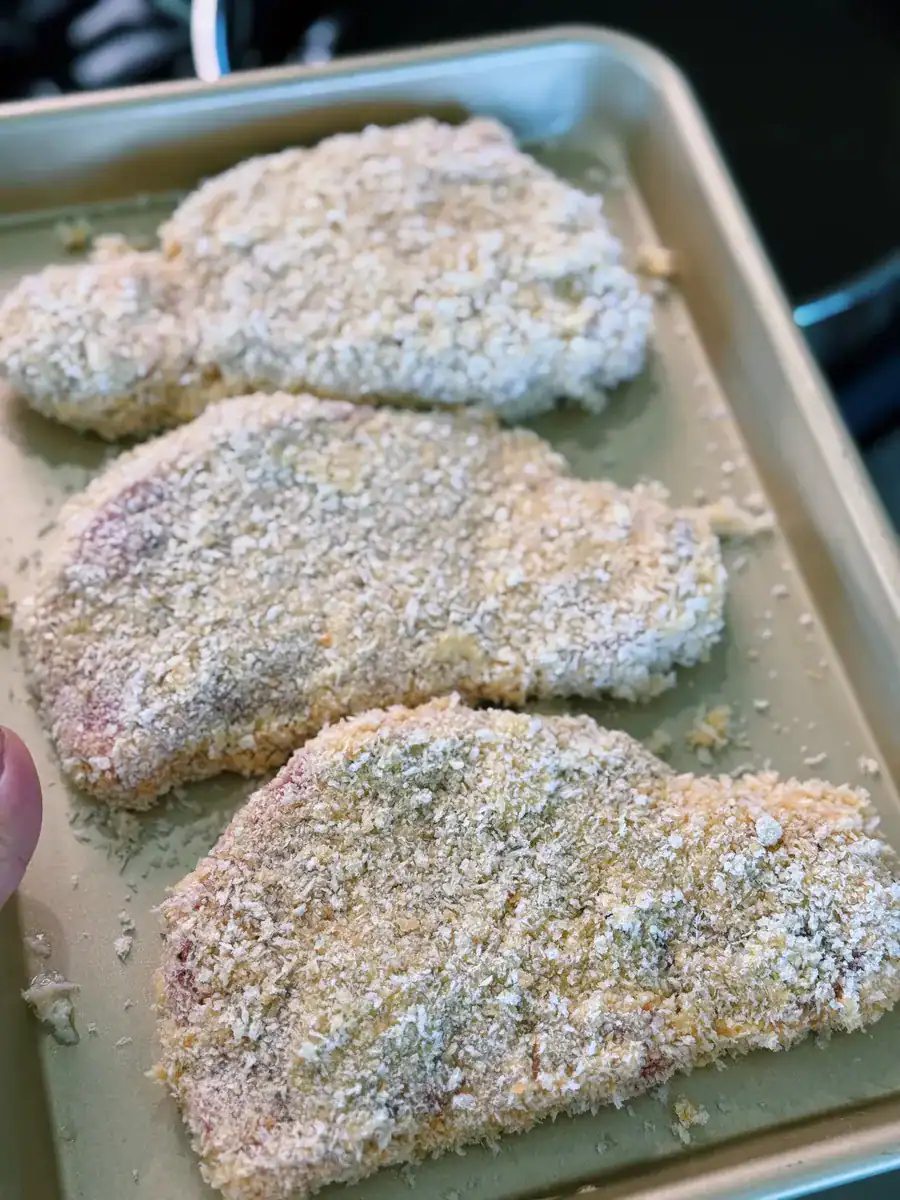 Boneless pork chop battered and breaded with panko for Tonkatsu