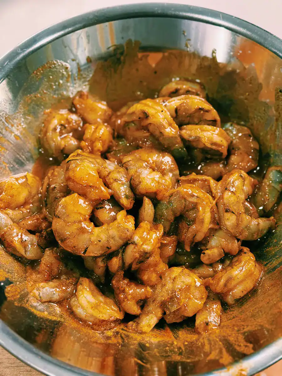 Marinating Shrimp in turmeric, paprika, and other spices for One Pot Coconut Prawn Curry
