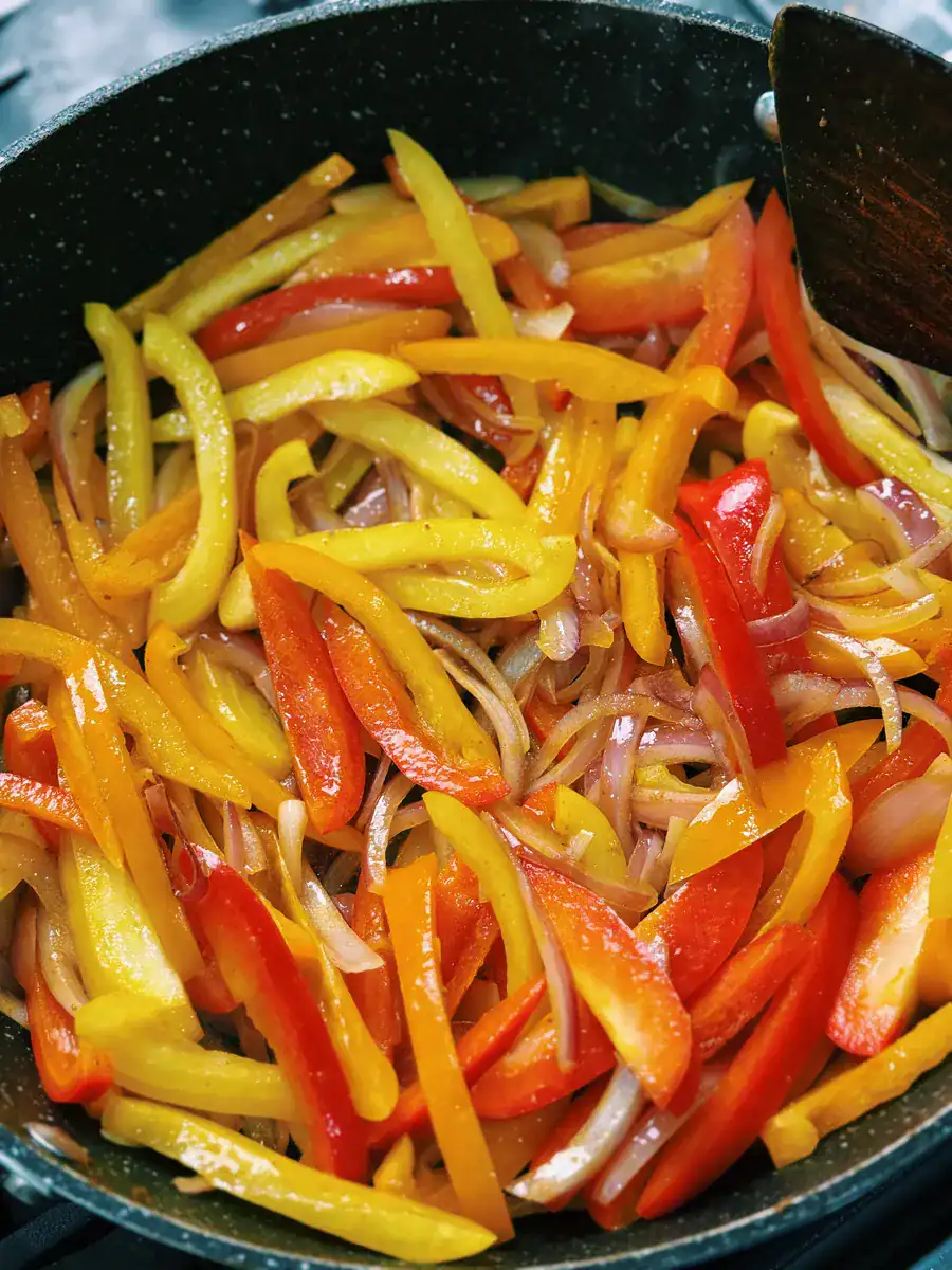 Sautéing bell peppers and onions for One Pot Coconut Prawn Curry