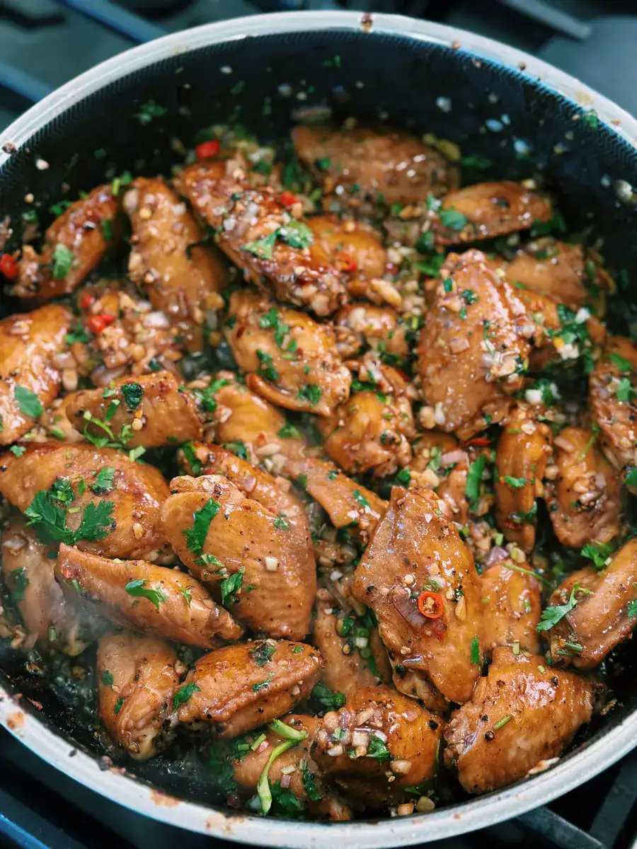 Thai Insired Chili Lime Chicken Wings mixed in with spices and aromatics
