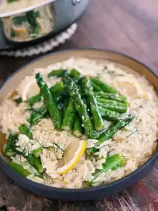 Creamy Lemon Orzo with Garlic Asparagus served with fresh Lemon Wedges