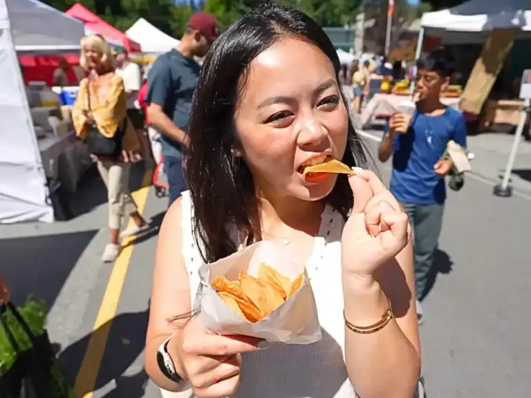 Tiffy taste testing foods at the Sechelt Farmer’s Market while visiting the sunshine coast