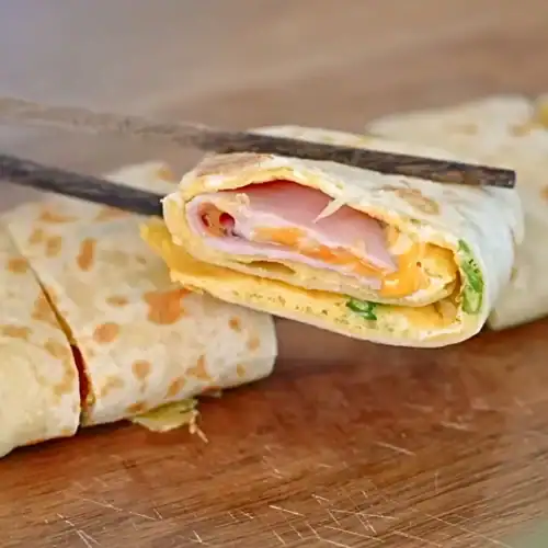 A ham and cheese Taiwanese-inspired Breakfast Wrap