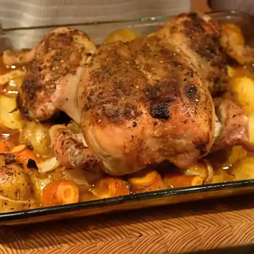 Whole Roast Chicken served straight out of the oven with roasted vegetables