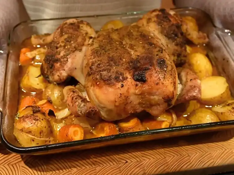 Whole Roast Chicken served straight out of the oven with roasted vegetables