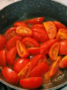 Sautéing tomato Slices for Tomato Beef Egg Stir Fry
