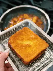 Freshly fried Hong Kong French Toast ready to be drizzled with cinnamon apple sauce for Cinnamon Apple French Toast
