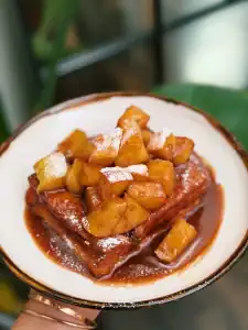 Hong Kong Style Cinnamon Apple French Toast, topped with powdered sugar