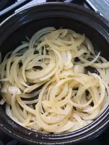 Sauting onion in chicken fat for Chicken Curry Udon Soup