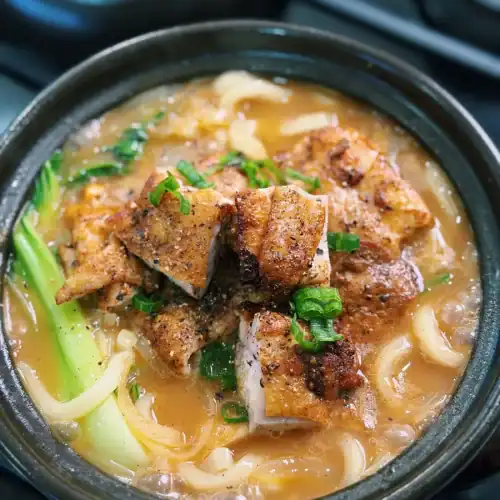 Chicken Curry Udon Soup served with chunks of pan fried curry chicken thighs