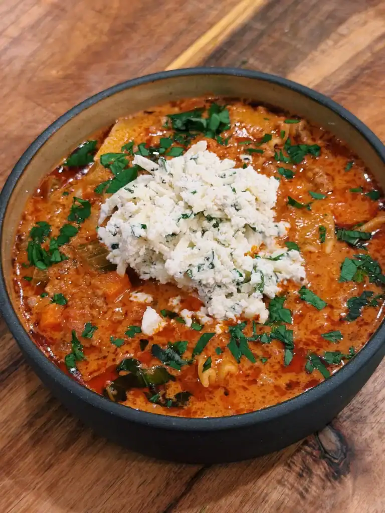 Tomato and Beef Lasagna Soup Topped with Creamy Cheese Topping