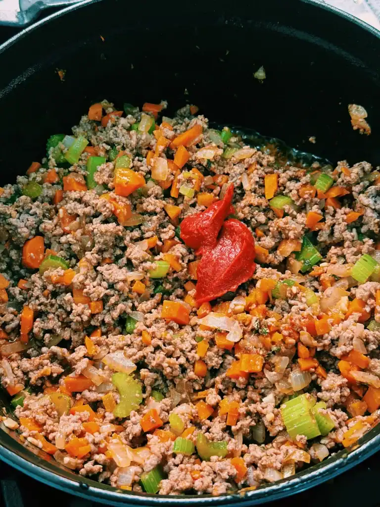 Browning beef with onion, carrots, and celery for Lasagna Soup