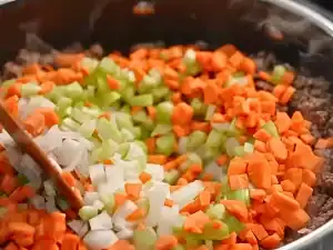 Add chopped onion, carrots, celery to browned beef to make Shepherd’s Pie Base
