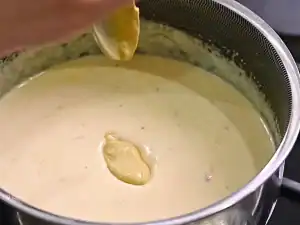 Adding mustard to creamy cheese sauce for Creamy Cauliflower Bake