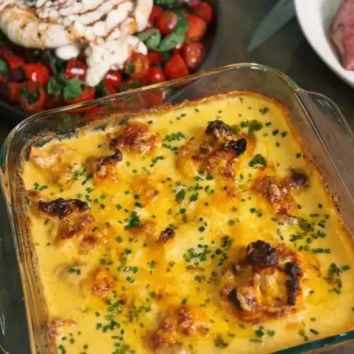 Cheesy Baked Cauliflower, part of a spread for hosting and holiday meals