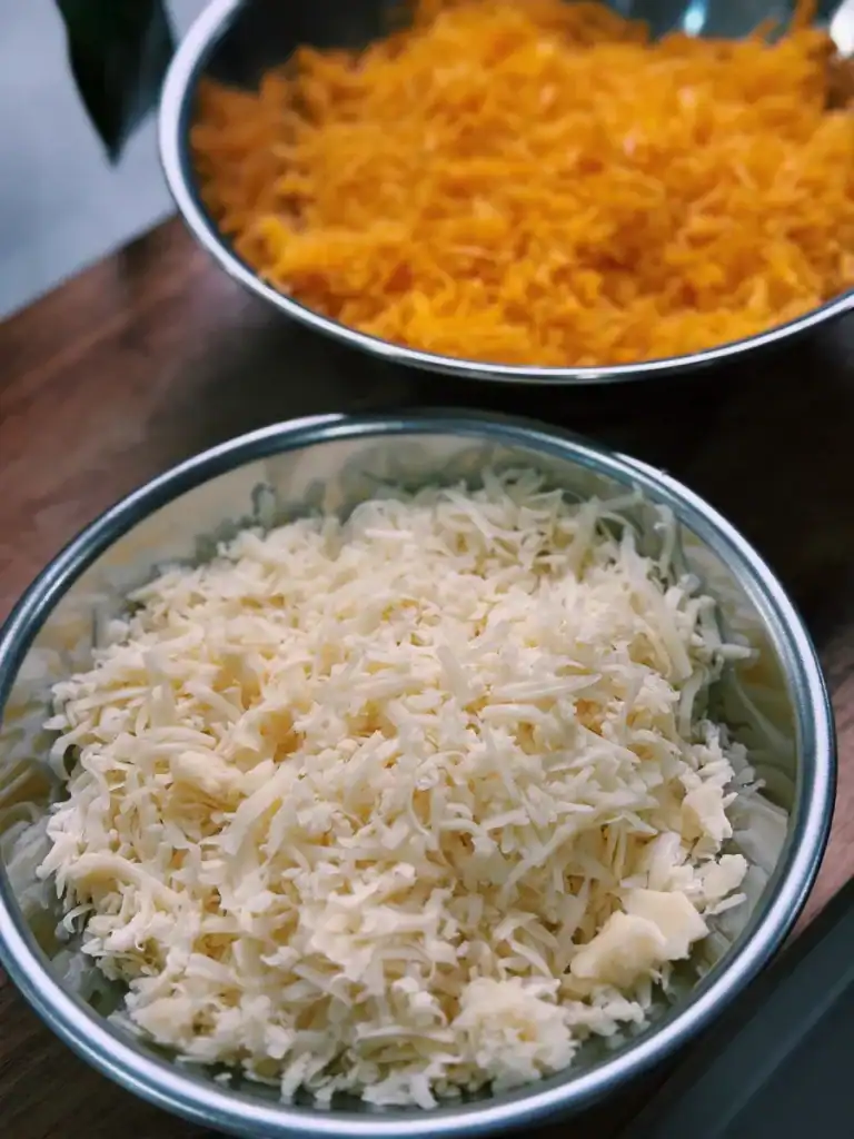 Shredded mozzarella and cheddar for cheesy cauliflower bake