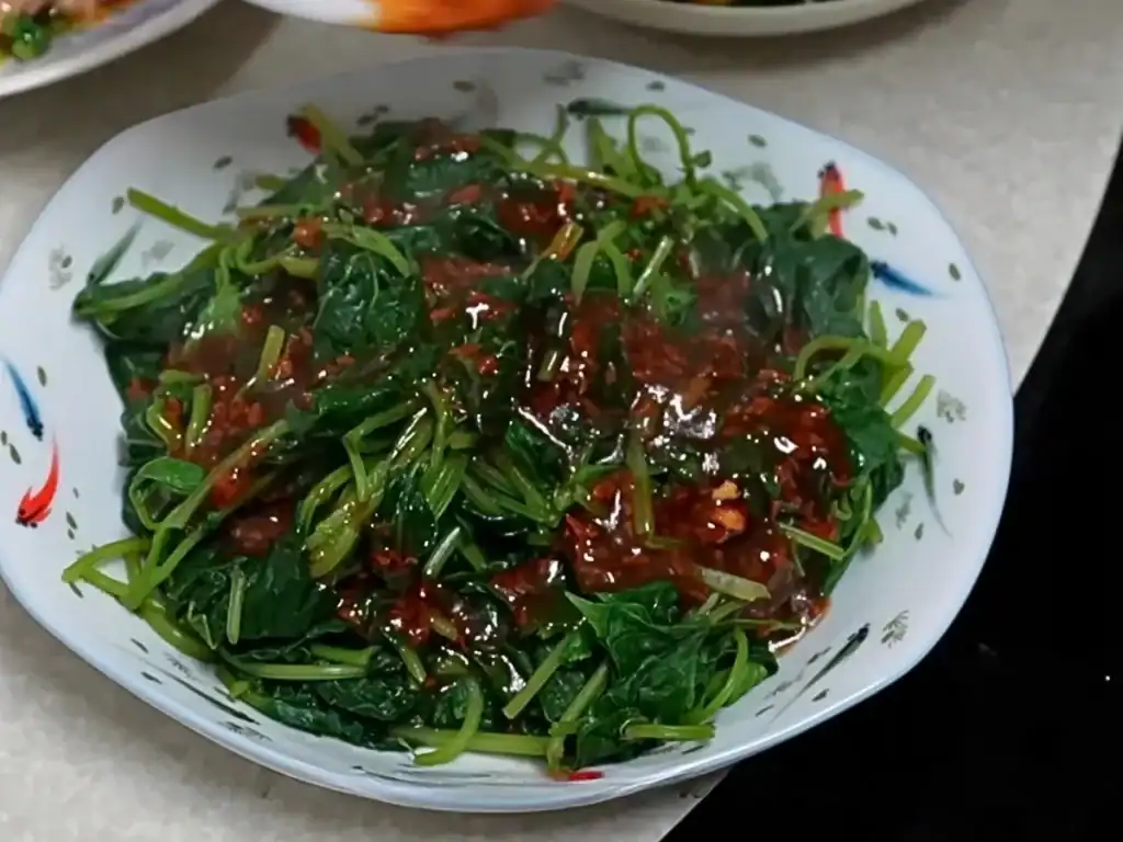 Blanched Sweet Potato Leaves drizzled with garlic sauce made with oyster sauce, kai dong everyday garlic oil, and sesame oil