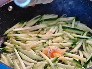 In a pan on medium high, add sliced zucchini, sesame oil, minced garlic, shrimp paste, and white pepper. Saute for 1-2 minutes until zucchini is cooked. Set Aside as topping for Braised Chicken Noodle Soup
