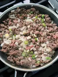 Browning ground beef with green onion for Minced Beef and Egg Rice