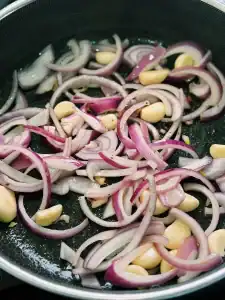 Sautéing Red onions and Garlic for Soy Glazed Apple Chicken