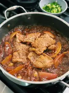 Adding soy honey glaze into Soy Glazed Apple Chicken