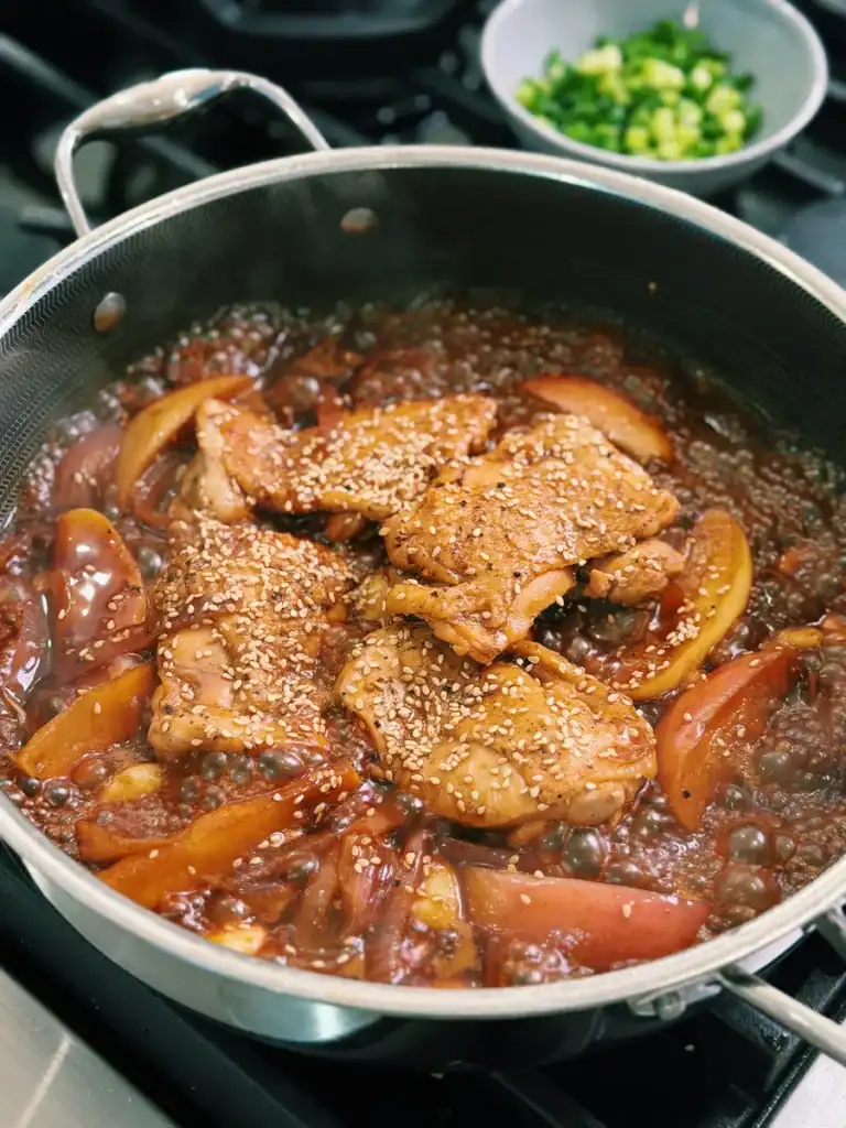 Adding soy honey glaze into Soy Glazed Apple Chicken