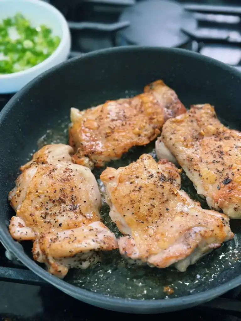 Pan Frying Chicken Thigh Until Golden for Hawaiian Shoyu Chicken
