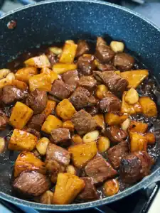 Add all ingredients back into the pan for Garlic Pineapple Steak Bites