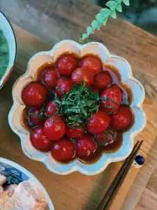A dish of marinated Japanese Tomato Salad garnished with chopped shiso