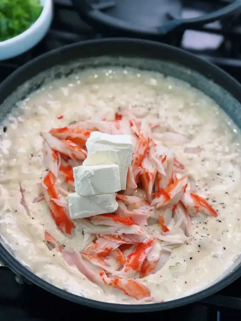 Adding imitation crab and cream cheese to crab Rangoon fillings
