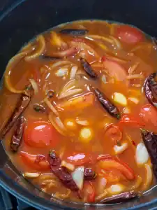 Simmering stock for beef braising base for Taiwanese Birria Tacos