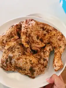 Seasoned chicken legs ready for roasting to make Oven Roasted Chicken Legs