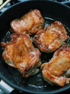 Pan Frying Taiwanese Five Spice Soy Chicken, showing desired golden color