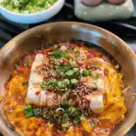 Spicy Garlic Tofu Omelette served with sesame seeds and chopped green onions